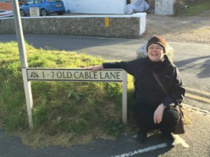 Caroline in front of sign